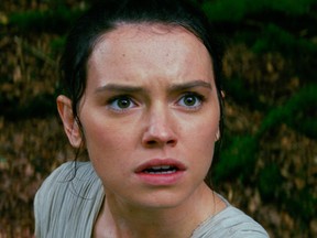 This photo provided by Disney/Lucasfilm shows Daisy Ridley, right, as Rey, and BB-8, in a scene from the film, "Star Wars: The Force Awakens," directed by J.J. Abrams. (Film Frame/Disney/Lucasfilm via AP)