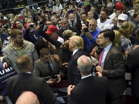 U.S. Republican presidential candidate Donald Trump is greeted by supporters during a campaign rally at the Pensacola Bay Center in Pensacola, Florida January 13, 2016.   REUTERS/Michael Spooneybarger