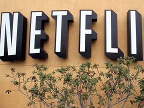 In this April 22, 2011 file photo, the Netflix logo is displayed at the company's headquarters in Los Gatos, Calif.  (AP Photo/Paul Sakuma, File)