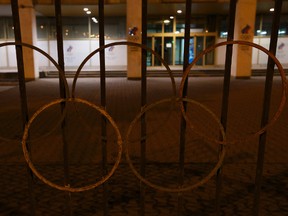 Rusty Olympic rings decorate a fence outside the Russian Olympic committee building in Moscow on Nov. 9, 2015. (Ivan Sekretarev/AP Photo)