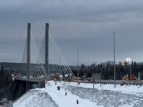 Repair work continues on the damaged Nipigon River Bridge in Nipigon, Ont., Thursday, Jan.14, 2016. (THE CANADIAN PRESS/HO-Martine Laberge/Radio-Canada)