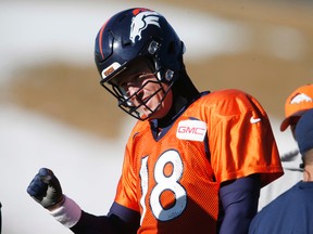 Broncos quarterback Peyton Manning gestures to coaches during practice in Englewood, Colo., on Thursday, Jan. 14, 2016. (David Zalubowski/AP Photo)
