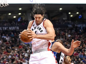 Toronto Raptors forward Luis Scola grabs a rebound against the Dallas Mavericks in the first half at Air Canada Centre in Toronto on Dec. 22, 2015. (Dan Hamilton/USA TODAY Sports)