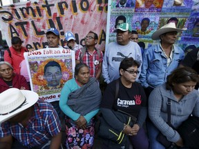Relatives of the 43 students missing from Ayotzinapa College Raul Isidro Burgos take part in a news conference after a meeting with Mexico's Attorney General Arely Gomez at her office, in Mexico City, Mexico, January 14, 2016. The 43 students disappeared in the southwestern state of Guerrero in late 2014. REUTERS/Edgard Garrido
