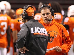 BC Lions’ Head Coach Mike Benevides (right) during the second half of pre-season CFL game against the Calgary Stampeders  at BC Place in Vancouver, B.C. on Friday June 20, 2014. Carmine Marinelli//QMI Agency