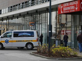 An ambulance is parked in front of an entrance at the CHU de Rennes hospital, in Rennes, France, where six people are in a serious condition after taking part in a medical trial for an unnamed European laboratory to test a new drug, France's health ministry said Jan. 15, 2016. The trial was for a painkiller containing cannabis and took place at a laboratory in Rennes. (REUTERS/Stephane Mahe)