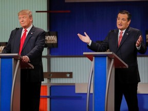 Republican U.S. presidential candidate businessman Donald Trump, left, listens as rival candidate Sen. Ted Cruz speaks during the Fox Business Network Republican presidential candidates debate in North Charleston, S.C., on Jan. 14, 2016. (REUTERS/Chris Keane)