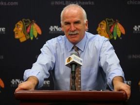 Chicago Blackhawks head coach Joel Quenneville during the post game press conference after achieving a tie for the second-winningest coach in NHL history in a game against the Nashville Predators at the United Center on Jan. 14, 2016. (Dennis Wierzbicki-USA TODAY Sports)