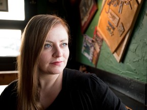 Celtic rock singer Derina Harvey sits by the window at the Atlantic Trap and Gill pub in Edmonton on Monday, Jan. 11. Derina Harvey was prompted to create a band, The Derina Harvey Band, after the owner of the pub told her to do so - Yasmin Mayne.
