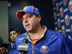 Jack Capuano of the New York Islanders speaks with the media prior to the game against the Detroit Red Wings at the Nassau Veterans Memorial Coliseum on March 29, 2015 in Uniondale, N.Y. (Bruce Bennett/Getty Images/AFP)