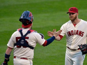 Cleveland Indians pitcher Cody Allen (37) and catcher Roberto Perez (55) celebrate a 3-1 win over the Boston Red Sox at Progressive Field. (David Richard/USA TODAY Sports)