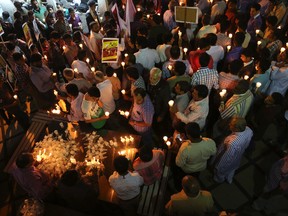 Kashmiri Shiite Muslims hold candles during a protest against Saudi Arabia in Srinagar, Indian controlled Kashmir, Tuesday, Jan. 5, 2016. Hundreds of Shiite Muslim in Indian portion of Kashmiri rallied in the Shia dominated areas protesting against Saudi Arabia , after they announced on Saturday it had executed 47 prisoners convicted of terrorism charges, including al-Qaida detainees and a prominent Shiite cleric who rallied protests against the government. (AP Photo/Dar Yasin)