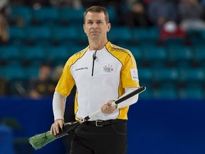 Manitoba skip Jeff Stoughton follows a rock on the way to defeating Quebec at the Tim Hortons Brier in Kamloops, B.C., on March 9, 2014. THE CANADIAN PRESS/Andrew Vaughan