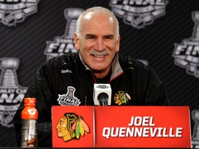 In this June 7, 2015, file photo, Chicago Blackhawks coach Joel Quenneville smiles as he talks during a news conference in Chicago. (AP Photo/Nam Y. Huh, File)