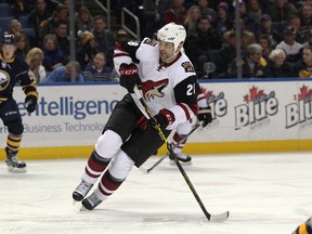 Arizona Coyotes left winger John Scott looks for the puck during the first period against the Buffalo Sabres at First Niagara Center in Buffalo on Dec. 4, 2015. (Timothy T. Ludwig/USA TODAY Sports)