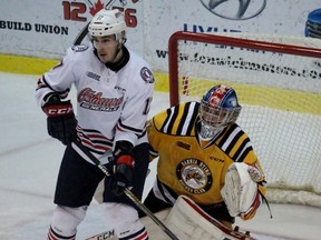 Sarnia Sting goalie Charlie Graham looks around the screen of Oshawa Generals forward Alex Renaud during the Ontario Hockey League game at the Sarnia Sports and Entertainment Centre on Friday, Jan. 15, 2016 in Sarnia, Ont. Graham made his Sting home debut while Renaud played against Sarnia for the first time since being traded by the team earlier this season. (Terry Bridge, Sarnia Observer)