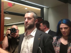 In this May 29, 2015, file photo, television actor Dustin Diamond, center, leaves court in Port Washington, Wisc., after being convicted of two misdemeanors stemming from a barroom fight on Christmas Day 2014. Jail time is on hold for the former "Saved by the Bell" actor while he appeals his sentence for an altercation at a bar in Wisconsin. Diamond was supposed to begin serving a four-month sentence last weekend at county jail north of Milwaukee. On Thursday, July 2, 2015, a judge in Ozaukee County Circuit Court stayed Diamond's sentence pending his appeal. (AP Photo/Dana Ferguson, File)
