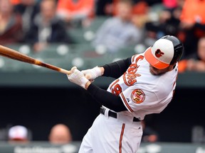 Baltimore Orioles first baseman Chris Davis (19) doubles against the New York Yankees at Oriole Park at Camden Yards. (Tommy Gilligan/USA TODAY Sports)