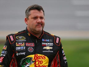 Tony Stewart stands on the grid during qualifying for the NASCAR Sprint Cup Series CampingWorld.com 500 at Talladega Superspeedway on October 24, 2015 in Talladega, Alabama. (Sarah Crabill/Getty Images/AFP)