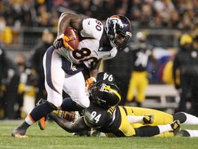 Denver Broncos tight end Vernon Davis (80) is tackled by Pittsburgh Steelers linebacker Lawrence Timmons (94) during the second half at Heinz Field on December 20, 2015. (Jason Bridge-USA TODAY Sports)