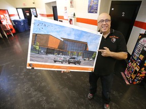 Adam Tocci, president of the Maples Recreation Association, holds a rendering of a $21-million expansion to the Maples Community Centre. The Manitoba government, today,  committed to fund one third of the project, up to $7 million, Saturday, January 16, 2016. (Winnipeg Sun/Postmedia Network)