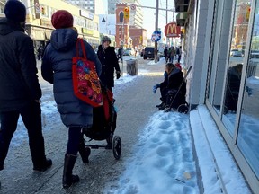 A person asking for change on the street in downtown Ottawa on Thursday January 14, 2016. 
Errol McGihon/Ottawa Sun
