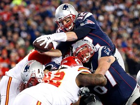 New England Patriots quarterback Tom Brady (12) dives for a touchdown during the second quarter against the Kansas City Chiefs in the AFC Divisional round playoff game at Gillette Stadium on Saturday, January 16, 2016. (Greg M. Cooper-USA TODAY Sports)