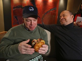 Rita DeMontis of the Toronto Sun interviews Paul Wahlberg(L) and his brother Donnie on Jan. 16. The brothers covered a bunch of topics including the burger business, Toronto, Trump and the Jays. (Veronica Henri/Toronto Sun/Postmedia Network)