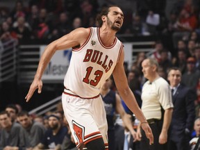 Chicago Bulls centre Joakim Noah (13) reacts after dislocating his shoulder against the Dallas Mavericks during the first half at the United Center in Chicago on January 15, 2016. (David Banks-USA TODAY Sports)