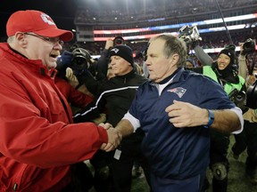 Kansas City Chiefs head coach Andy Reid and New England Patriots head coach Bill Belichick meet at midfield after an NFL divisional playoff football game, Saturday, Jan. 16, 2016, in Foxborough, Mass. The Patriots won 27-20. (AP Photo/Charles Krupa)