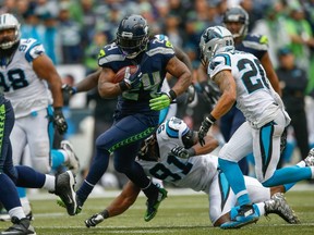 Running back Marshawn Lynch #24 of the Seattle Seahawks rushes against the Carolina Panthers at CenturyLink Field on October 18, 2015 in Seattle, Washington. The Panthers defeated the Seahawks 27-23. (Otto Greule Jr/Getty Images/AFP)