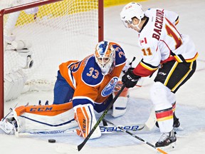 Edmonton's goalie Cam Talbot (33) stops Calgary's Mikael Backlund (11) from scoring during the overtime period of the Edmonton Oilers' NHL hockey game against the Calgary Flames at Rexall Place in Edmonton, Alta., on Saturday, Jan. 16, 2016. The Oilers won 2-1. Codie McLachlan/Edmonton Sun/Postmedia Network