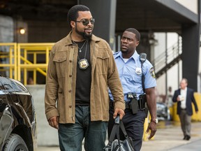 This photo provided by Universal Pictures shows, Ice Cube, left, as James Payton and Kevin Hart as Ben Barber in a scene from the film, "Ride Along 2." (Quantrell D. Colbert/Universal Pictures)