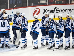 The Winnipeg Jets celebrate following a Jan. 15 game against the Minnesota Wild at Xcel Energy Center. The Jets will possibly be shorthanded due to injuries on Monday. (Brace Hemmelgarn-USA TODAY Sports)