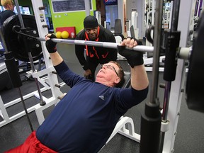 Kevin Palmer (right) works out with trainer Valentine Payne in Winnipeg. (Brian Donogh/Winnipeg Sun/Postmedia Network)