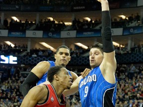 Raptors’ DeMar DeRozan works against Nikola Vucevic of the Magic last Thursday in London. The Raps are at home on Monday. (USA TODAY SPORTS/PHOTO)