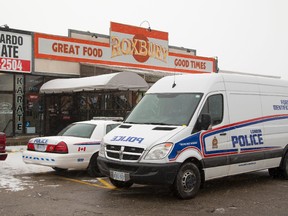 Police respond to a Sunday shooting at an east-end bar. (MIKE HENSEN, The London Free Press)