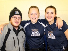 Sarah Martin, middle, and Bryn Pollard, right, pose with Lloydminster IceCats coach Shawn Kaschl following a practice at the Servus Sports Centre in Lloydminster. The Vermilion natives, who carpool together to practice, were named to the Northeast Zone for the Alberta Winter Games.