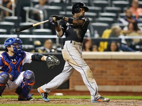 Miami Marlins' Dee Gordon hits a ninth-inning, two-run home run off New York Mets relief pitcher Dario Alvarez during a baseball game in New York. (AP/Kathy Willens, File)