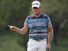 Jamie Donaldson of Wales gestures as waits to putt during his final round of the Thailand Golf Championship at Amata Spring Country Club, Chonburi, Thailand, Sunday, Dec. 13, 2015. (AP/Mark Baker)