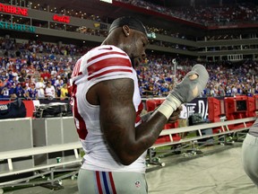 New York Giants defensive end Jason Pierre-Paul unwraps his hand at the end of a game against the Tampa Bay Buccaneers at Raymond James Stadium. (Kim Klement/USA TODAY Sports)