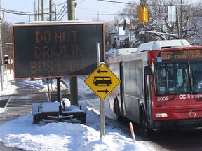 OC Transpo buses are re-routed onto Scott Street in Ottawa Monday, Jan. 18, 2016. A section of the Transitway is closed to accommodate LRT construction. (Tony Caldwell Ottawa Sun/Postmedia Network)