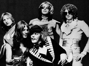 An ad for Mott the Hoople's single "Roll Away The Stone" published in Billboard in  1974 shows (from left to right) Dale Griffin, Ariel Bender, Morgan Fisher (front), Overend Watts, Ian Hunter. (Wikipedia)