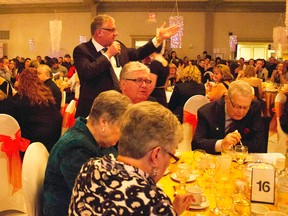 John Stephens of Great West Auction works the crowd during the live auction portion of the 2015 Hearts for Youth Gala. This year's version of the annual fundraiser for Sarnia-Lambton Rebound is Feb. 6 at the Dante Club. (Handout)