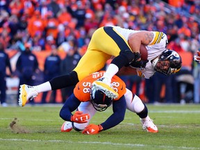 Denver Broncos outside linebacker Von Miller tackles Pittsburgh Steelers tight end Matt Spaeth during the second quarter of the AFC divisional round playoff game at Sports Authority Field at Mile High in Denver on Jan. 17, 2016. (Mark J. Rebilas/USA TODAY Sports)