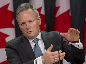 Bank of Canada Governor Stephen Poloz looks up as he holds news conference in Ottawa, Tuesday, December 15, 2015. Poloz has been named The Canadian Press 2015 Business Newsmaker of the Year. THE CANADIAN PRESS/Fred Chartrand