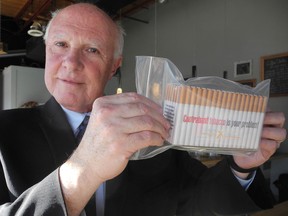 This is what a baggie of contraband cigarettes looks like, as displayed in Brighton Monday by national spokesman Gary Grant of the National Coalition Against Contraband Tobacco. CECILIA NASMITH/Northumberland Today