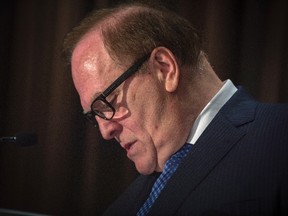 Marcel Aubut, the former president of the Canadian Olympic Committee speaks to reporters in Montreal on Oct. 9, 2015. (THE CANADIAN PRESS/Peter McCabe)