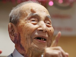 Yasutaro Koide, the 112-year-old living in the central Japanese city of Nagoya, smiles upon being formally recognized as the world's oldest man by the Guinness World Records at a nursing home in Nagoya Friday, Aug. 21, 2015. Koide was born on March 13, 1903 and worked as a tailor when he was younger. He became the world’s oldest man with the death of Sakari Momoi of Tokyo in July at age 112. (AP Photo/Koji Sasahara)
