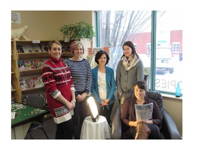 Christine Blazecka (left to right) Jessica Horne from the Cochrane Public library, Micheline Gagnon, Michelle Pronovost, and Emma Taillefer from the Minto Counselling Centre display the new Bright Light therapy lamp that is located at the Library.